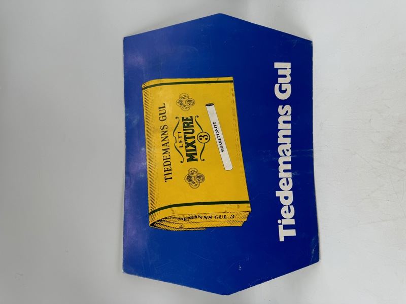Tiedemans gul m/ plakat i papp 50-60 tallet