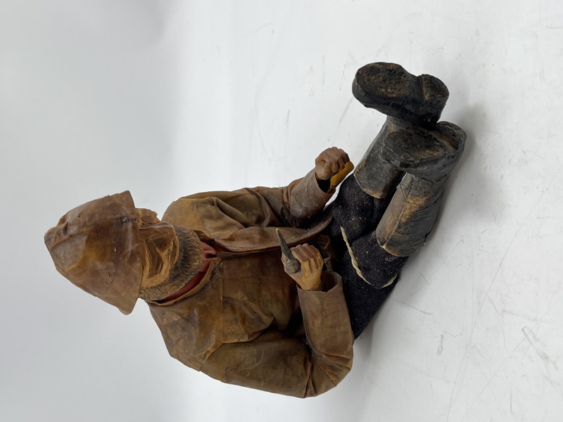 Gammel sittende Fisker