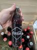 24 coca cola flasker ( noen tomme)