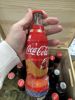 24 coca cola flasker ( noen tomme)