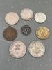 8 mynter/ medaljer
